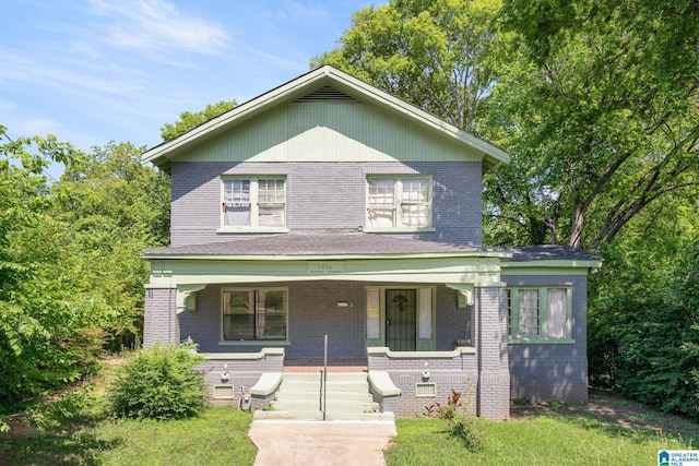 view of front of property featuring covered porch