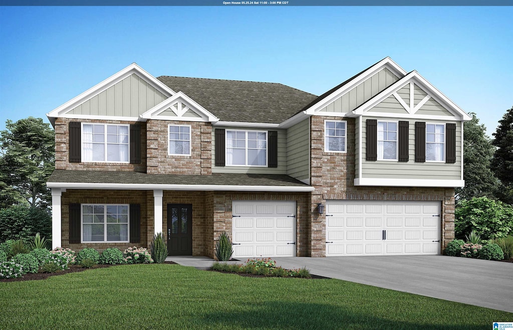 view of front of house featuring a front lawn and a garage