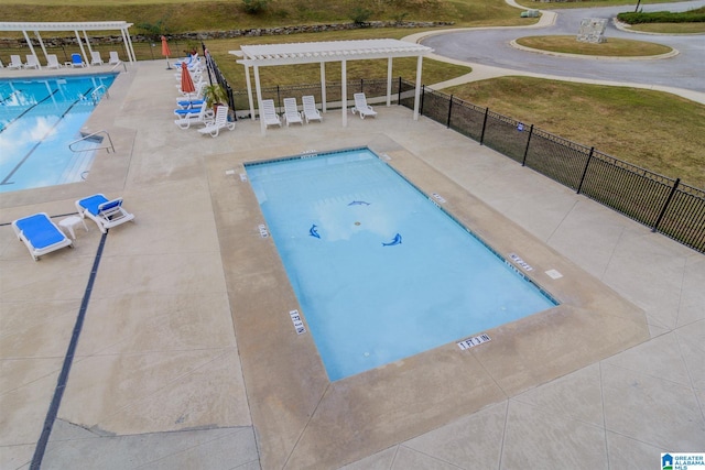 view of swimming pool featuring a pergola and a patio area