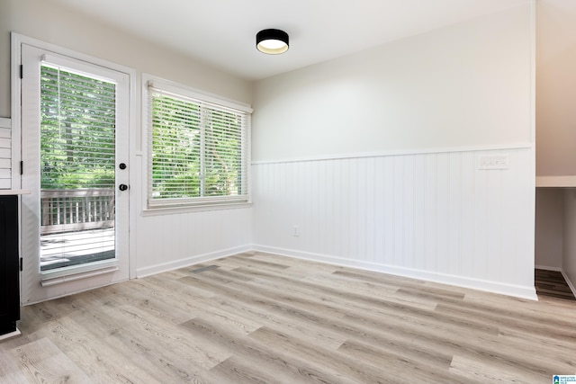 doorway to outside with light wood-type flooring