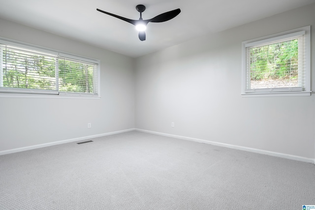 empty room with carpet flooring and ceiling fan