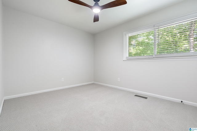 unfurnished room featuring carpet flooring and ceiling fan