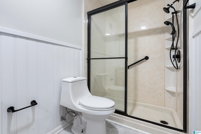 bathroom featuring an enclosed shower and toilet