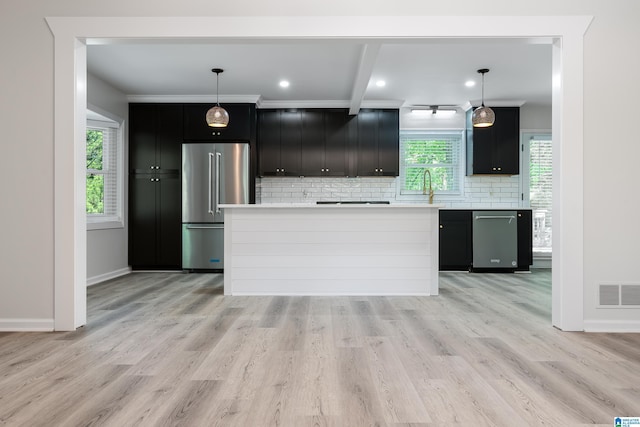 kitchen with pendant lighting, light wood-type flooring, and high end fridge