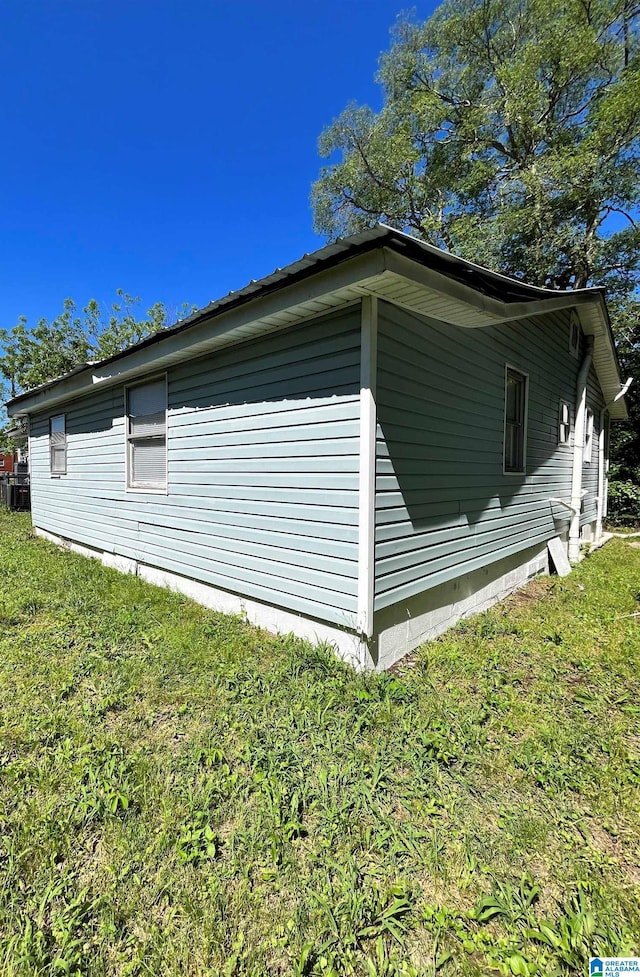 view of property exterior featuring a lawn