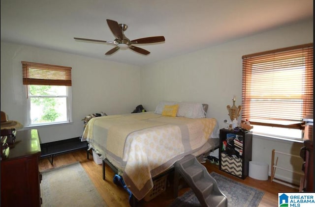 bedroom featuring ceiling fan and hardwood / wood-style floors