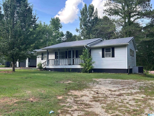 single story home with central AC unit, a front lawn, and covered porch