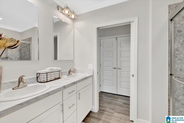 bathroom featuring vanity, hardwood / wood-style flooring, and walk in shower