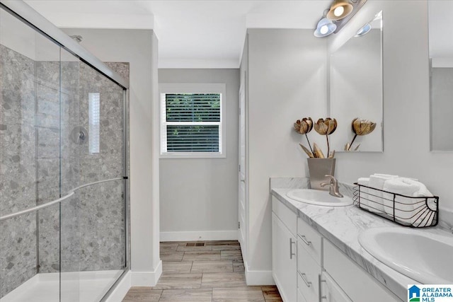 bathroom with hardwood / wood-style floors, vanity, walk in shower, and ornamental molding