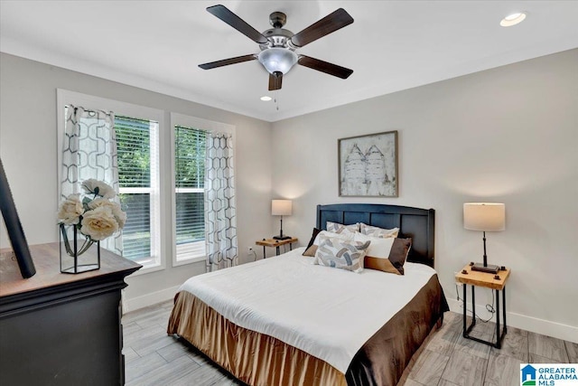 bedroom featuring light hardwood / wood-style flooring and ceiling fan