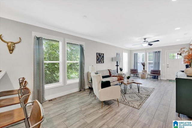 living room with ceiling fan and light hardwood / wood-style flooring