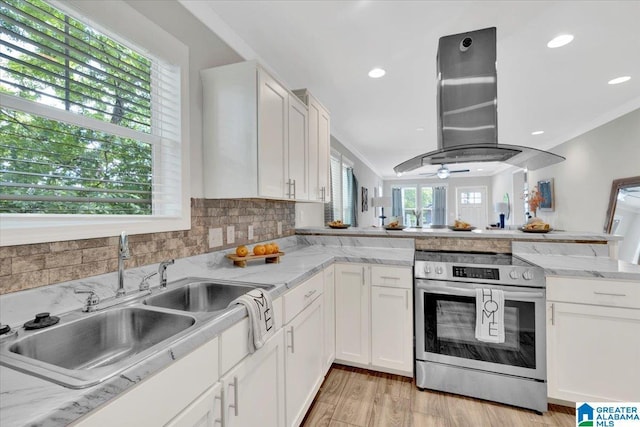 kitchen with white cabinets, crown molding, and island exhaust hood