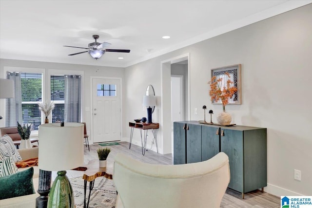 living room with ceiling fan and light hardwood / wood-style floors