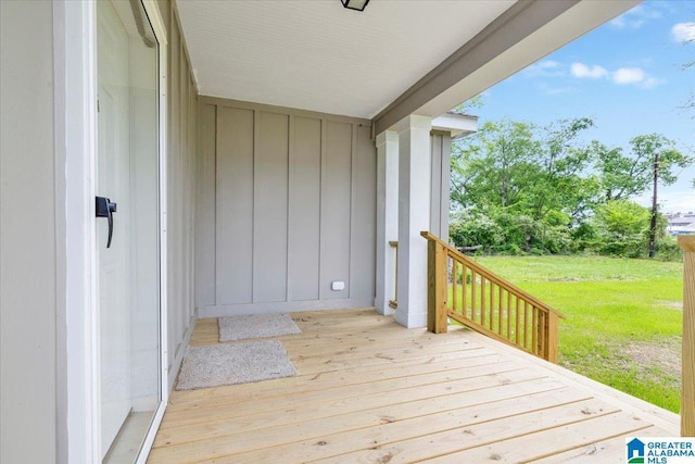 wooden deck with a yard