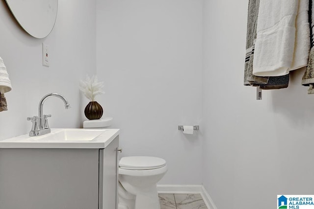 bathroom featuring vanity and toilet