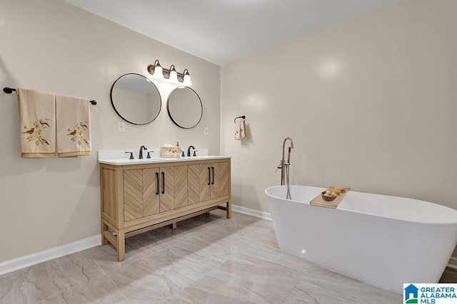 bathroom featuring a washtub and vanity