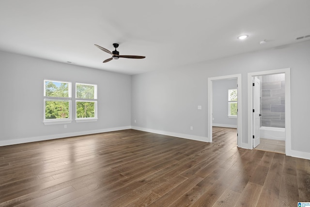 empty room featuring dark hardwood / wood-style floors and ceiling fan