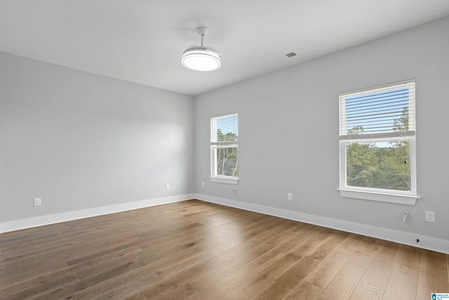 empty room with wood-type flooring