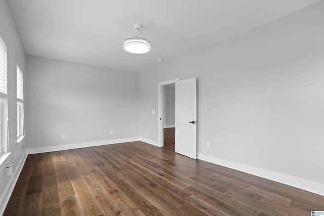 spare room featuring dark hardwood / wood-style flooring