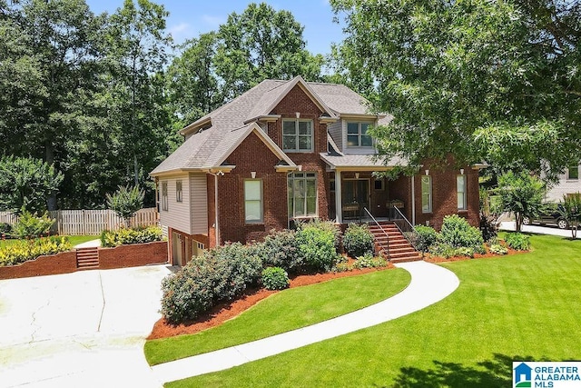 craftsman-style home with a front yard and a garage