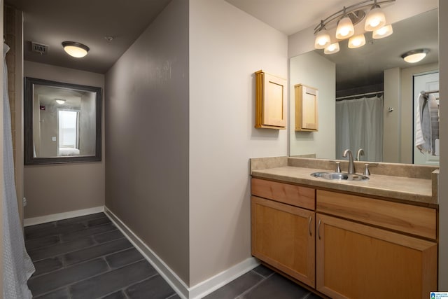 bathroom with tile floors and vanity