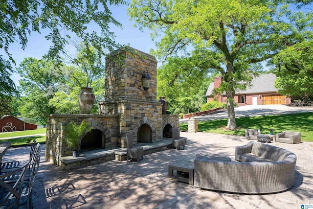 view of patio / terrace featuring an outdoor living space with a fireplace