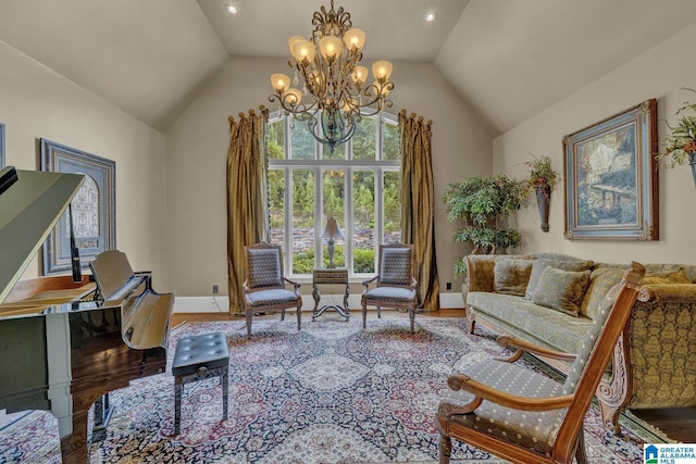 sitting room featuring vaulted ceiling, wood-type flooring, and an inviting chandelier