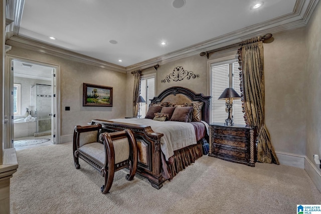 carpeted bedroom with ornamental molding and ensuite bath