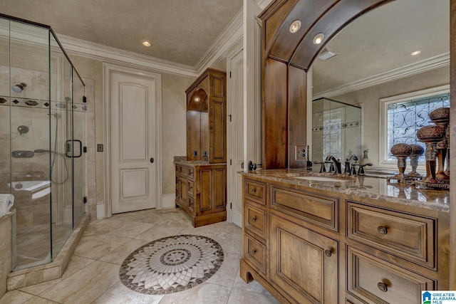 bathroom with ornamental molding, vanity, and a shower with door