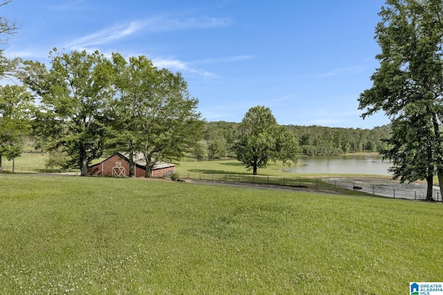 view of yard featuring a water view and a rural view