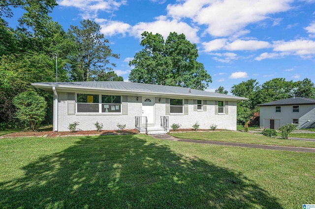 ranch-style home with a front yard