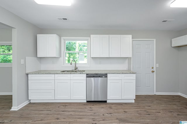 kitchen with hardwood / wood-style flooring, dishwasher, white cabinetry, and sink