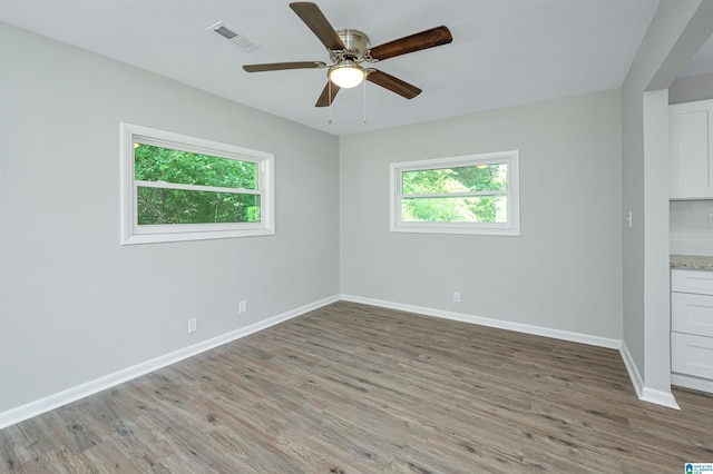 empty room featuring light hardwood / wood-style floors and ceiling fan