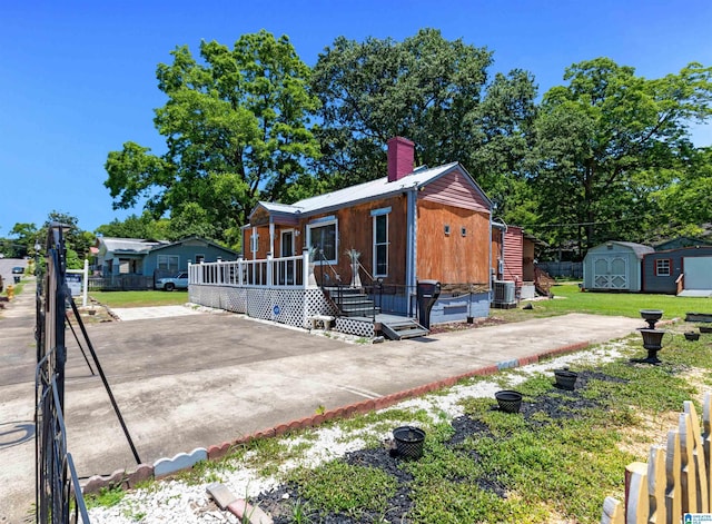 view of front of home with a storage unit