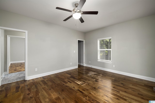 unfurnished bedroom with dark wood-type flooring and ceiling fan