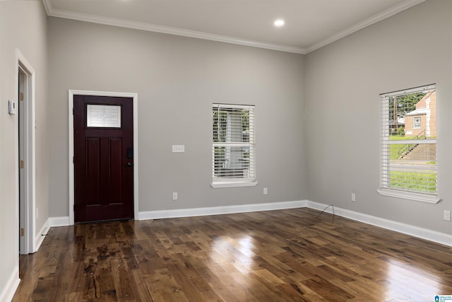 foyer entrance featuring ornamental molding and dark hardwood / wood-style flooring