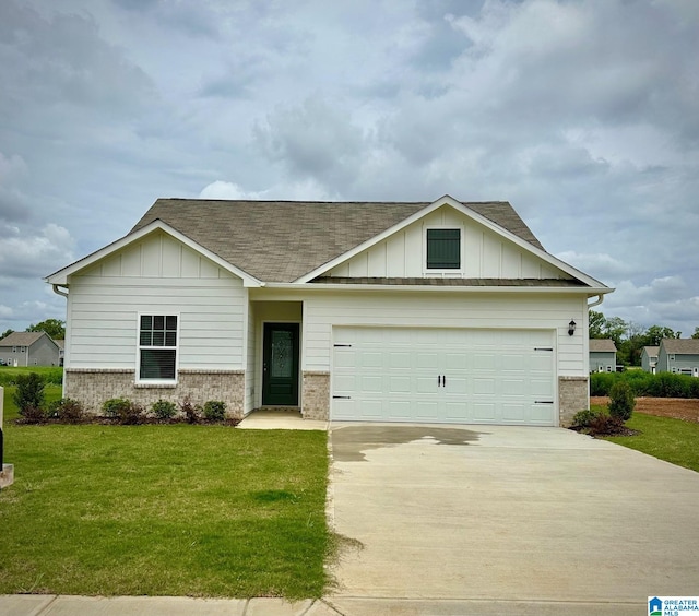 view of front of house featuring a garage and a front lawn