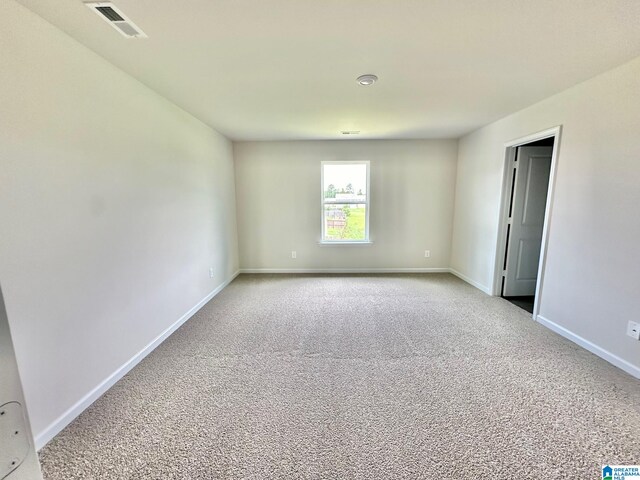 unfurnished bedroom with light colored carpet