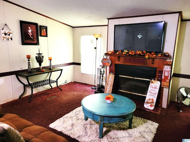 living room featuring carpet, a textured ceiling, and crown molding