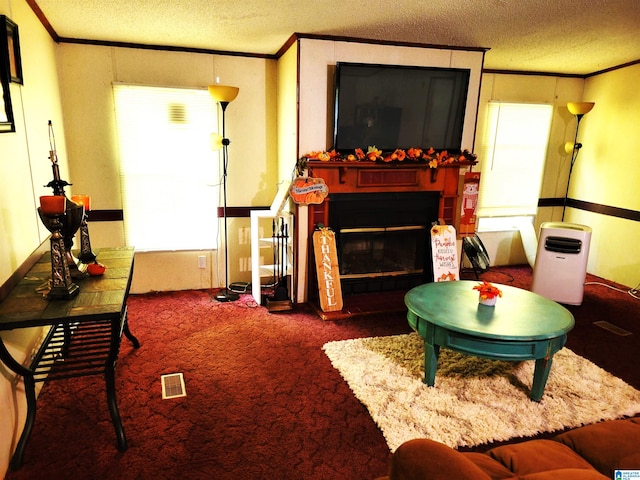 living room with ornamental molding, a textured ceiling, and dark colored carpet