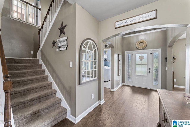 staircase with ceiling fan and a textured ceiling