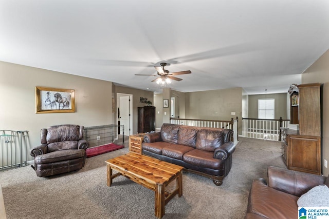 living room with ceiling fan and carpet floors