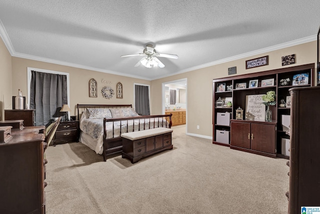 bedroom featuring ensuite bathroom, ceiling fan, a textured ceiling, and ornamental molding