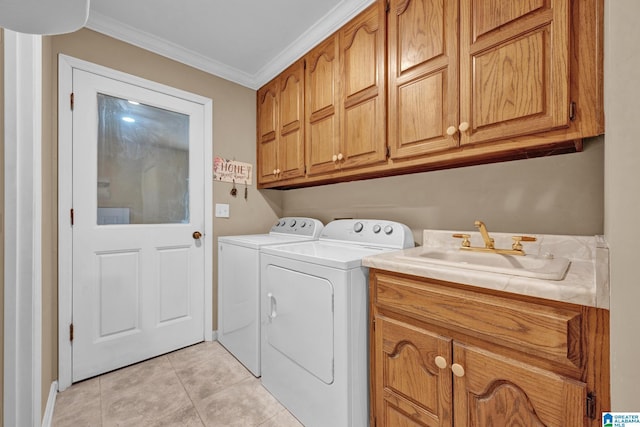 washroom with sink, cabinets, washer and clothes dryer, light tile patterned floors, and ornamental molding