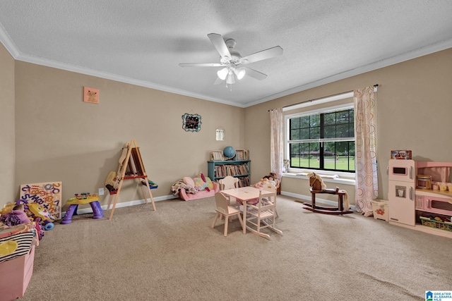 playroom featuring carpet flooring, crown molding, and a textured ceiling