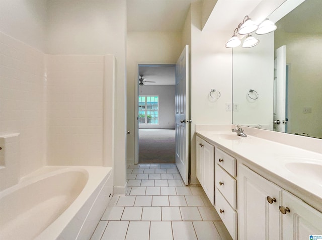 bathroom featuring ceiling fan, tile patterned flooring, and vanity