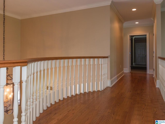 hallway featuring ornamental molding and hardwood / wood-style floors