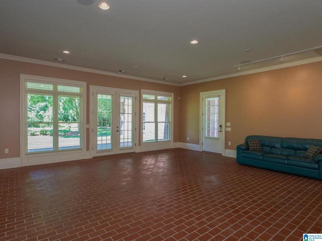 unfurnished living room featuring ornamental molding