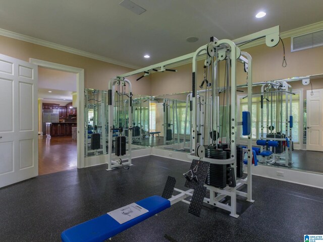 gym with ornamental molding