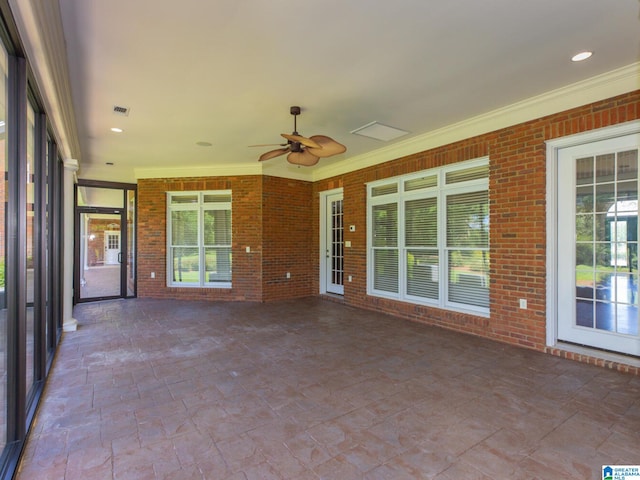 unfurnished sunroom with ceiling fan